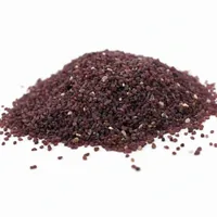 Red abrasive garnet sand mound on white studio background
