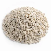 Close-up studio photo of Aluminium Silicate 30 mesh angular abrasive grit mound on white background