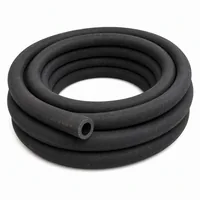 Industrial 19mm ID black rubber blast hose coiled on white background