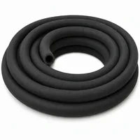 Coiled 32mm ID black rubber abrasive blast hose with textile reinforcement on white background