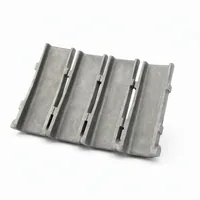 Blast Wheel Blade Set AR plate curved steel blades arranged on white background