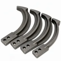 Set of four manganese steel blast wheel blades on white background