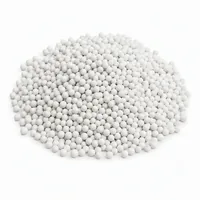 Mound of Ceramic Beads 90 mesh abrasive media on white background