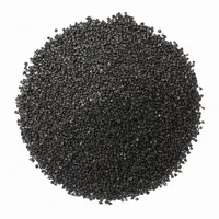 Close-up of dark angular Copper Slag abrasive grit on white background
