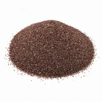 Close-up of reddish-brown Garnet Sand 50 mesh abrasive grains in a mound on a white background