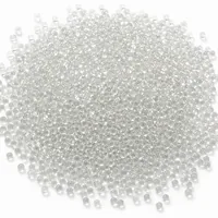 Mound of 20-mesh soda-lime glass beads abrasive media on white background