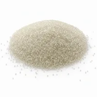 Mound of 30 mesh glass bead abrasive blasting media on white background