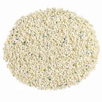 Urea plastic abrasive 12 mesh angular particles on white background