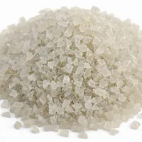 Mound of angular 120 mesh plastic abrasive blasting media on white background