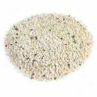 Close-up of Plastic Abrasive 20 mesh urea plastic blasting media granules on white background