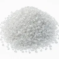 Mound of sharp angular plastic abrasive 240 mesh grit on white background
