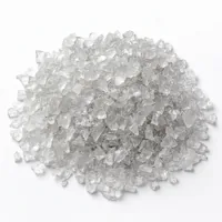 Mound of angular plastic abrasive 36 mesh grit on white background