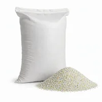 50 kg bag of Plastic Abrasive media with scattered angular granules on white background