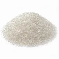 Mound of Plastic Abrasive 60 mesh Urea Thermoset granules on white background