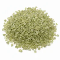 Mound of Plastic Media Type II 12 mesh angular abrasive strips on white background