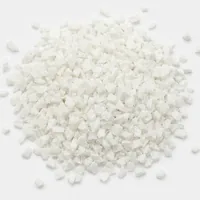 Mound of Plastic Media Type II 40 mesh angular abrasive particles on white background