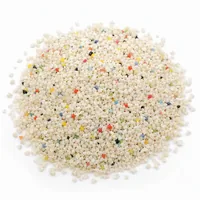 Close-up of angular Plastic Media Type III 24 mesh abrasive particles on white background