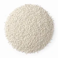 Close-up of angular Plastic Media Type III 30/60 mesh melamine abrasive grit on white background