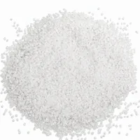 Mound of Plastic Media Type V 40 mesh angular acrylic abrasive grit on white background