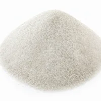 Mound of white 36 mesh quartz sand abrasive granules on white background