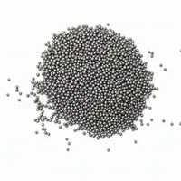 Stainless Steel Shot abrasive media top-down macro view on white background