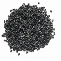 Close-up macro view of angular Steel Grit G12 abrasive particles on a white studio background