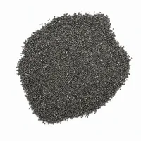 Close-up of angular Steel Grit G120 metallic abrasive particles on white background