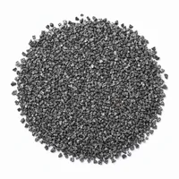 Mound of angular Steel Grit G50 metallic abrasive particles on white background