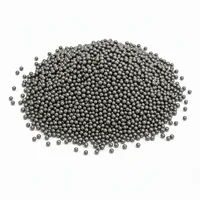 Mound of S170 cast steel shot abrasive media on white background