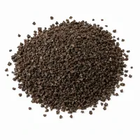 Close-up of dark brown Virgin Aluminum Oxide abrasive grit particles on a white background