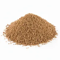 Mound of Walnut Shell 30/60 mesh abrasive media on white background